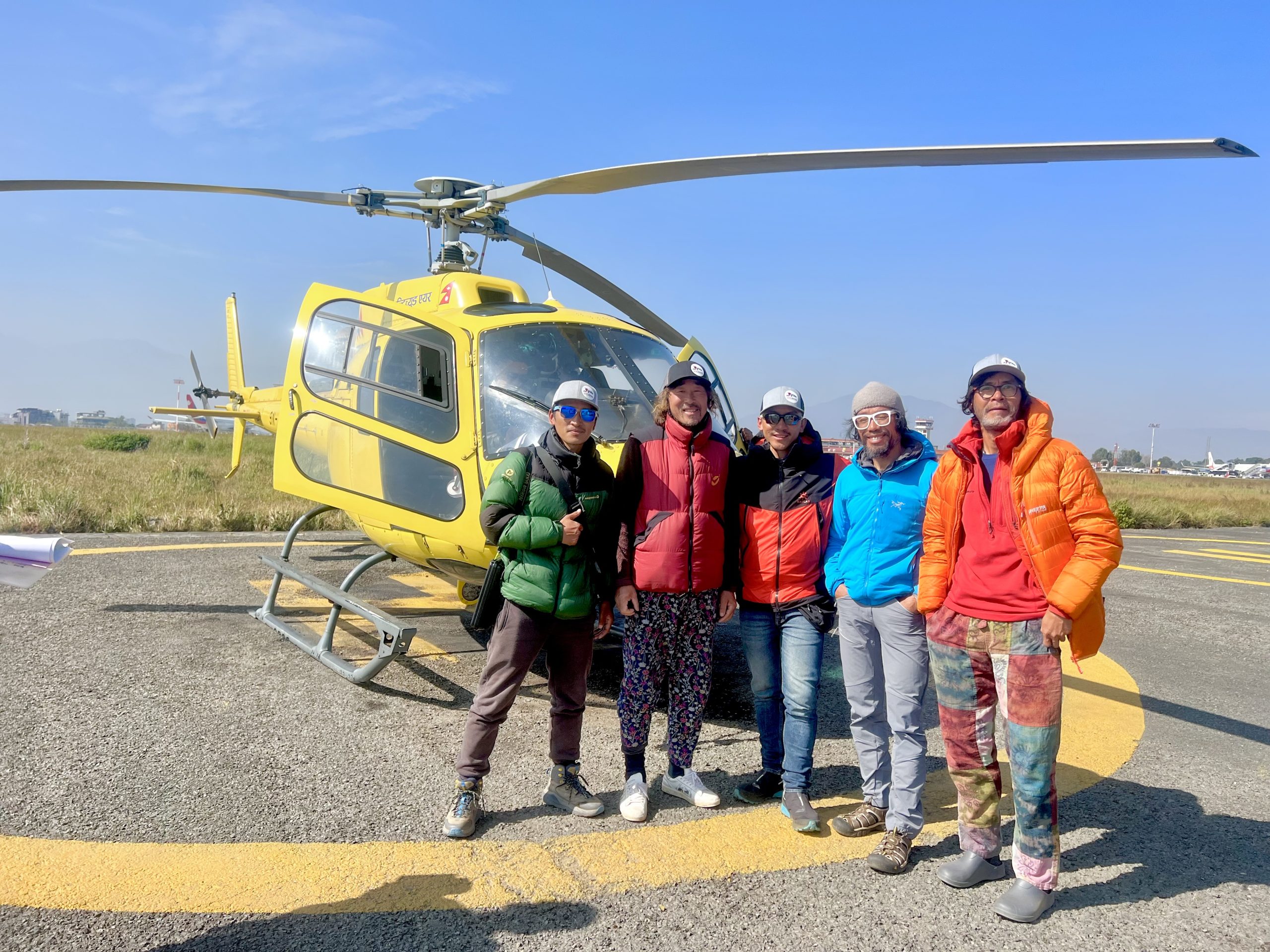 Group preparing for a scenic adventure with Taktok Brothers Heli Tours