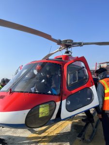 Helicopter on the ground, ready for a Taktok Brothers Heli Tour adventure.