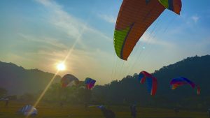 Group of people posing before embarking on a Taktok Brothers Paragliding Adventure.