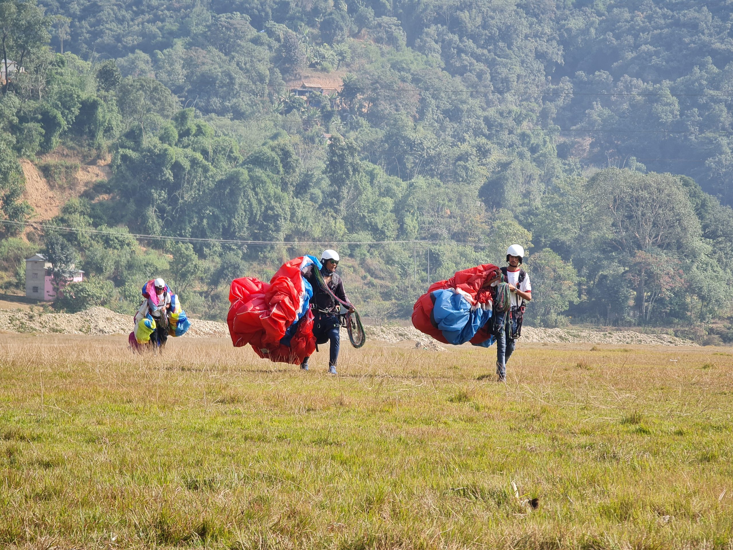 Group of participants getting ready for a paragliding adventure with Taktok Brothers.